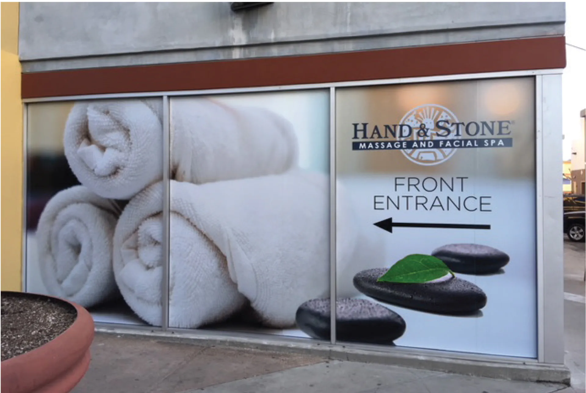 Hand and Stone branded window installation