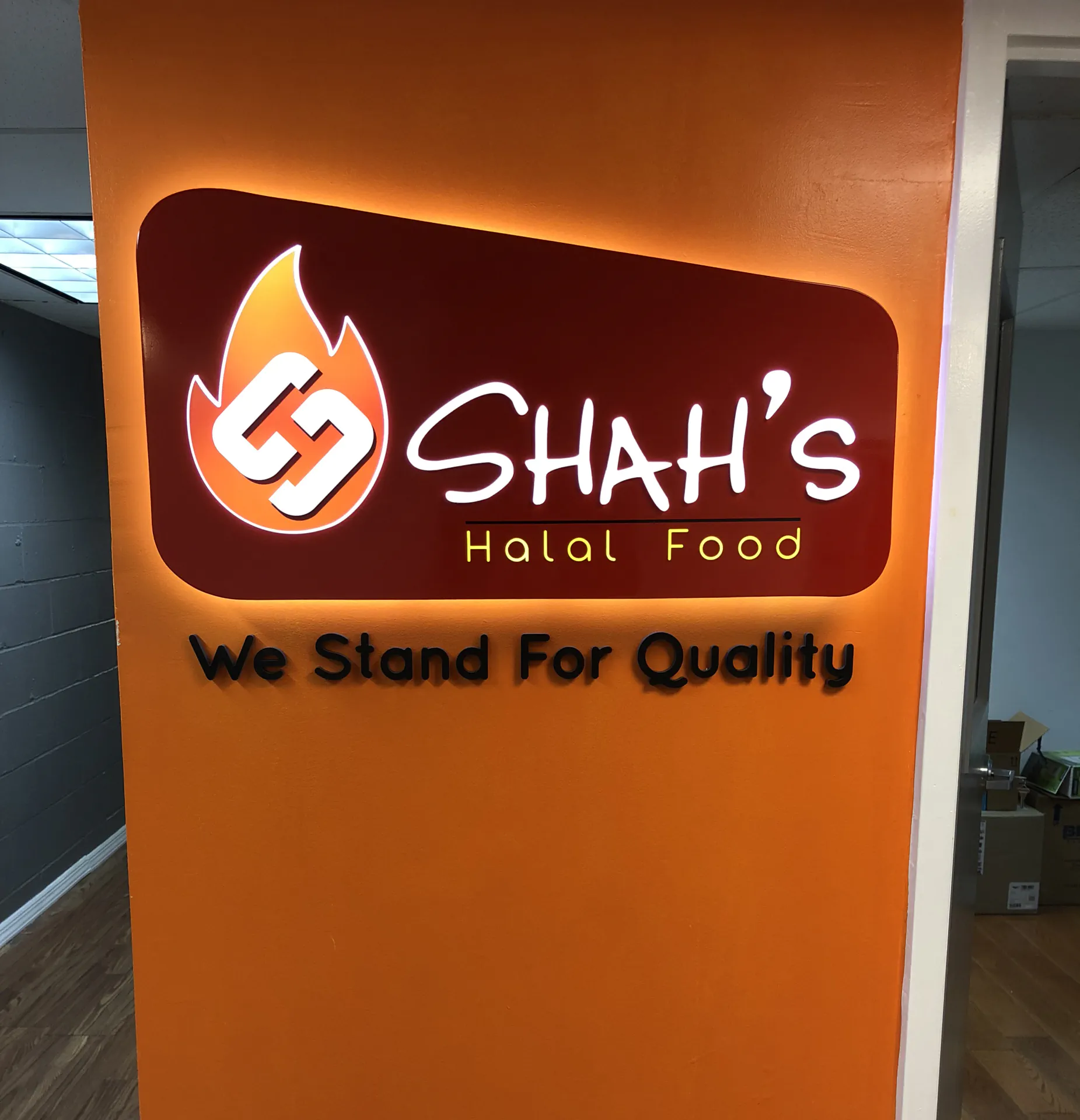 Shah's Halal Food backlit sign