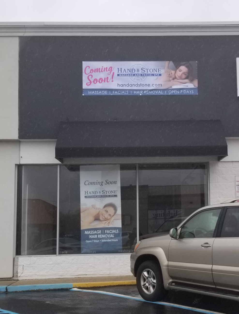 Hand and Stone coming soon exterior banner and window graphic
