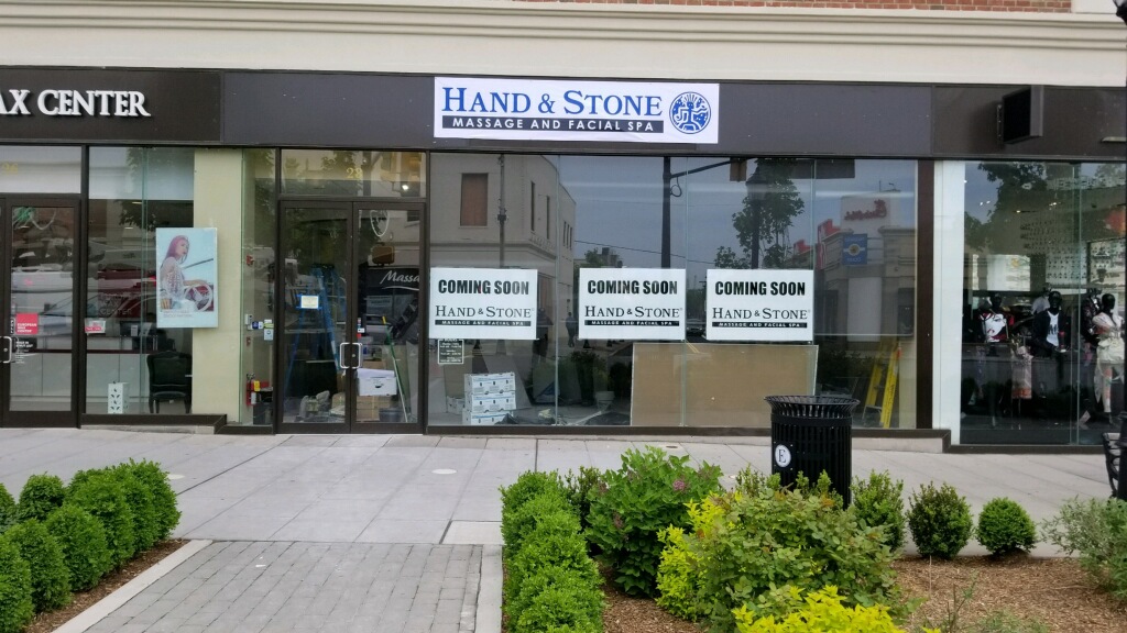 Hand and Stone coming soon storefront window banners