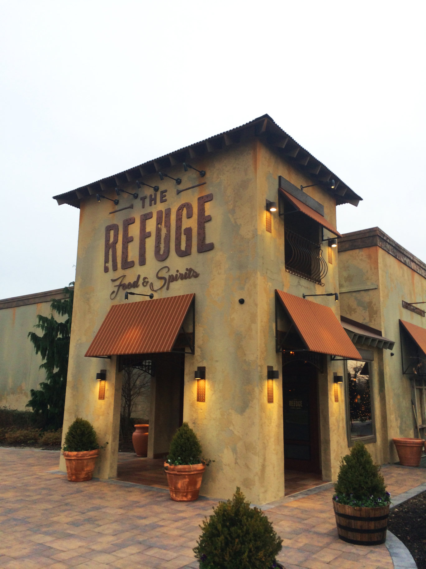 The Refuge exterior building sign and awnings